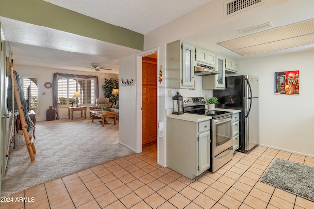 kitchen with light carpet, stainless steel appliances, a textured ceiling, and ceiling fan