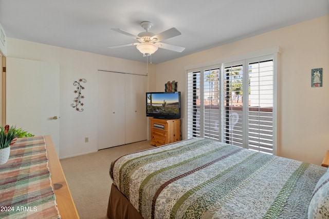 bedroom featuring a closet, ceiling fan, and light carpet