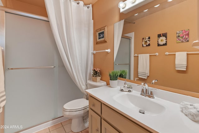 bathroom featuring vanity, toilet, tile patterned floors, and a shower with shower curtain