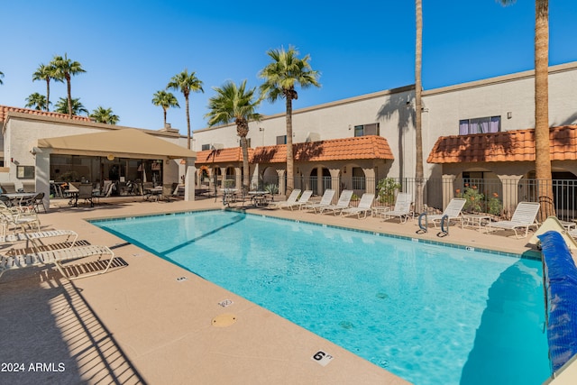 view of swimming pool featuring a patio