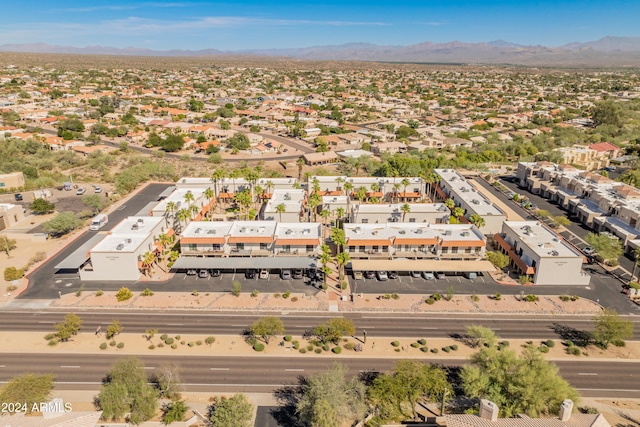 birds eye view of property with a mountain view