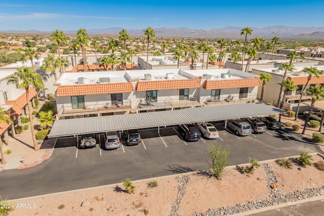 birds eye view of property with a mountain view