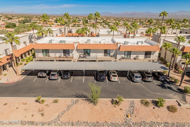 birds eye view of property featuring a mountain view