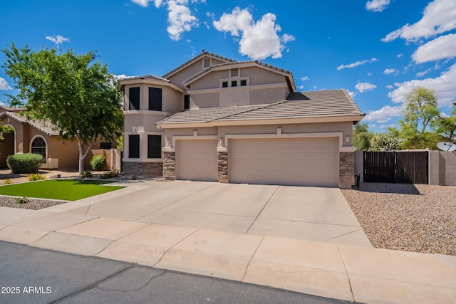 view of front facade featuring stone siding, a garage, stucco siding, a gate, and driveway