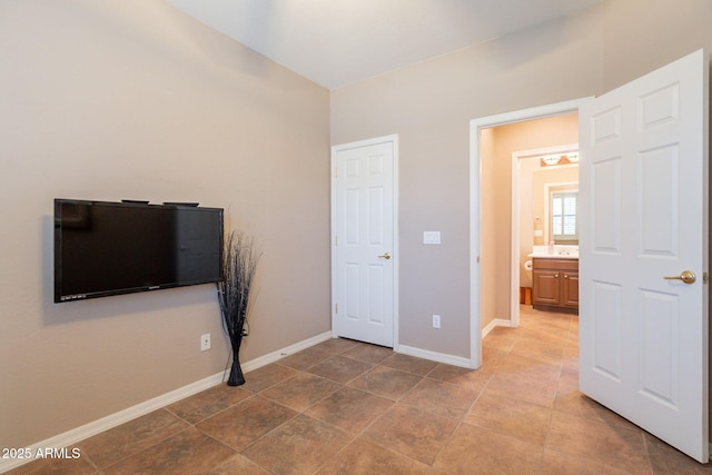 unfurnished bedroom with baseboards