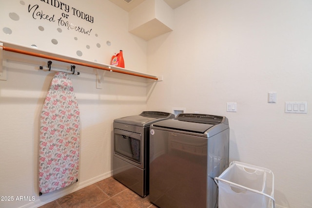 laundry room featuring baseboards, laundry area, tile patterned floors, and independent washer and dryer