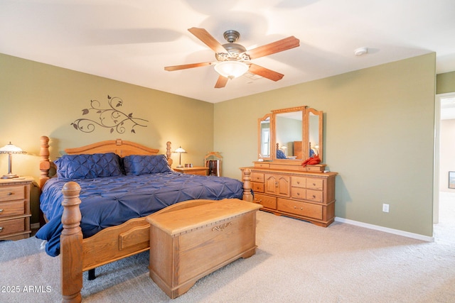 bedroom with baseboards, ceiling fan, and light carpet