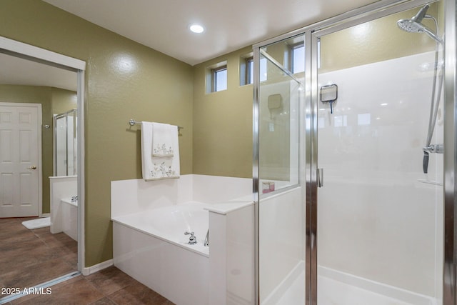 full bathroom featuring a stall shower, recessed lighting, and a bath