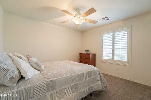 carpeted bedroom with baseboards, ceiling fan, and visible vents