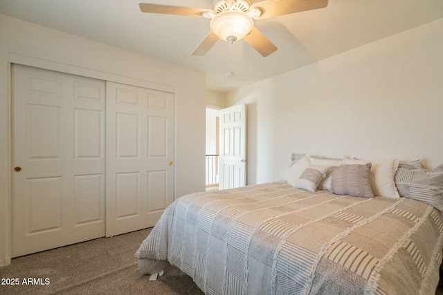 carpeted bedroom featuring ceiling fan and a closet