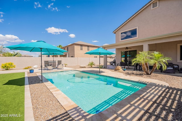 view of pool with a fenced in pool, a ceiling fan, a patio area, and fence