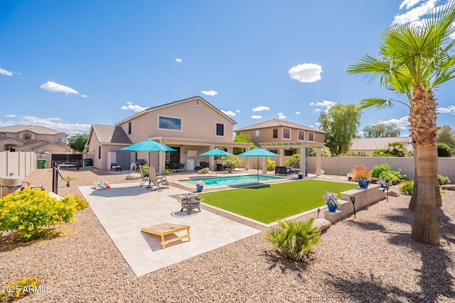 view of swimming pool featuring a fenced in pool, a patio, and a fenced backyard