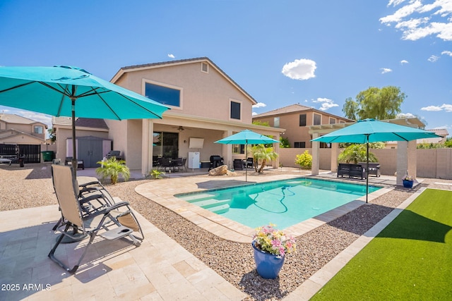 view of pool featuring outdoor dining space, a fenced in pool, a fenced backyard, and a patio area
