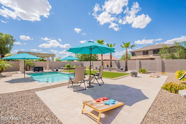 view of swimming pool with a fenced in pool, a fenced backyard, and a patio area