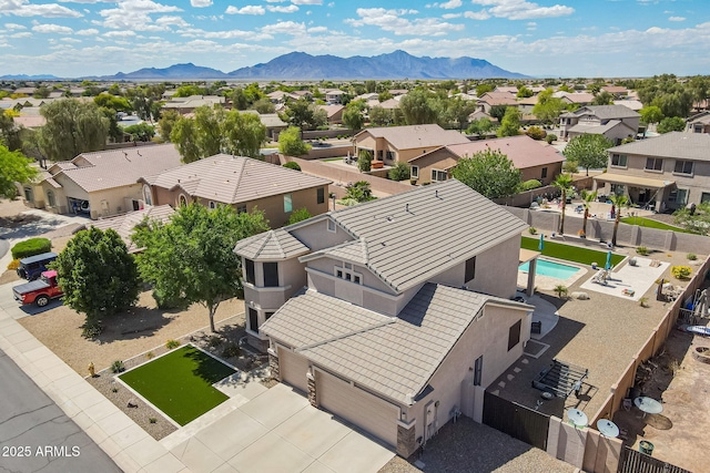 bird's eye view featuring a residential view and a mountain view