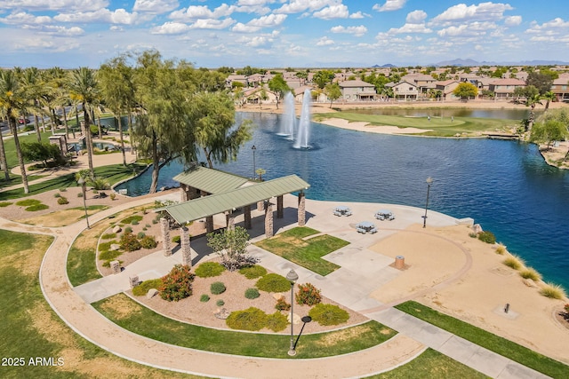 bird's eye view featuring a residential view and a water view