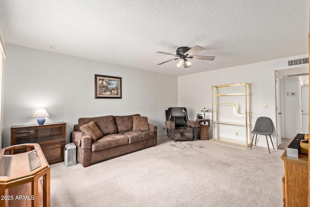 4501 E Carol Ave Unit 48, Mesa, AZ 85206 - carpeted living room featuring a ceiling fan and a textured ceiling