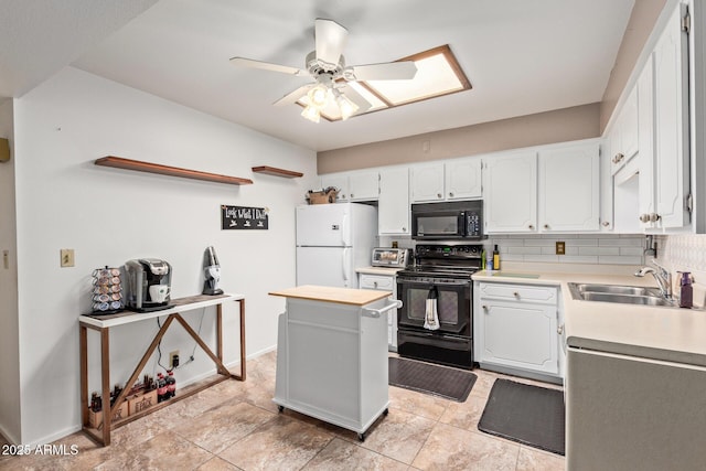 4501 E Carol Ave Unit 48, Mesa, AZ 85206 - kitchen with black appliances, a sink, light countertops, white cabinets, and a ceiling fan