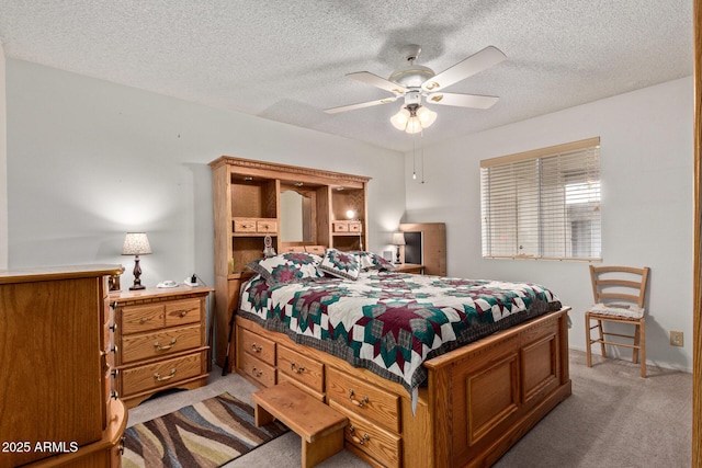 4501 E Carol Ave Unit 48, Mesa, AZ 85206 - bedroom with light carpet, a textured ceiling, and ceiling fan