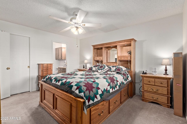 4501 E Carol Ave Unit 48, Mesa, AZ 85206 - bedroom featuring light colored carpet, ceiling fan, a textured ceiling, and ensuite bathroom
