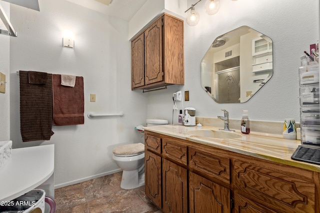 4501 E Carol Ave Unit 48, Mesa, AZ 85206 - bathroom featuring toilet, a shower, vanity, baseboards, and stone finish floors