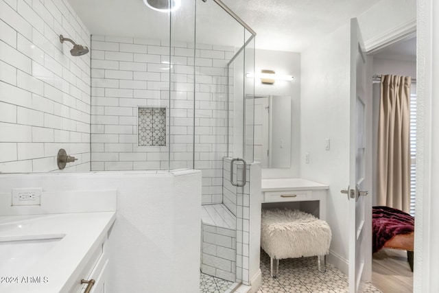 bathroom with vanity and a shower with shower door