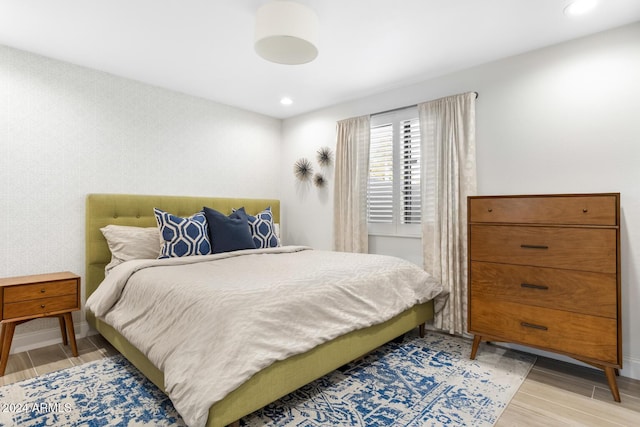 bedroom with light hardwood / wood-style floors