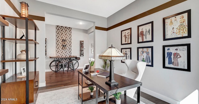 office space featuring wood finished floors and baseboards