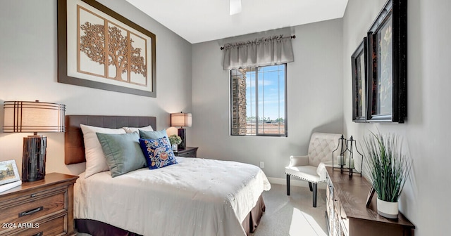 carpeted bedroom featuring baseboards