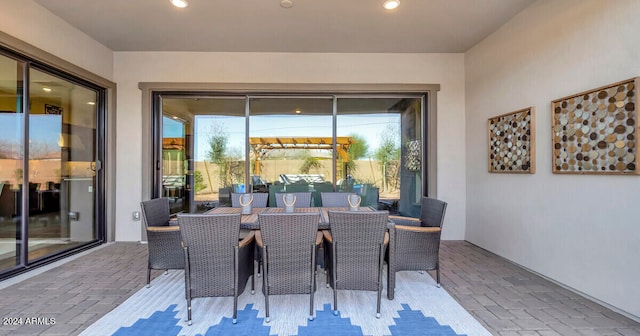 view of patio featuring outdoor dining area