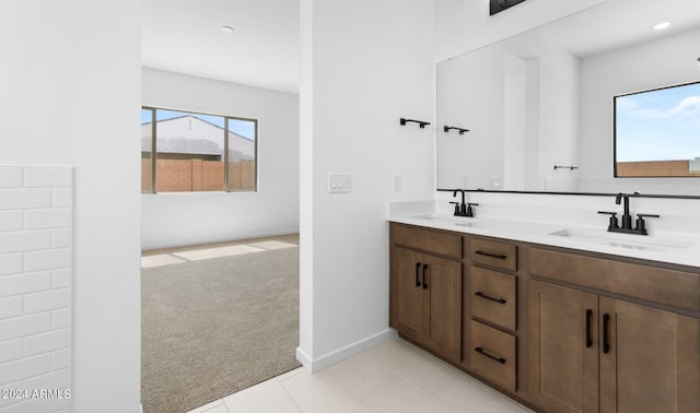 bathroom with tile patterned floors and vanity