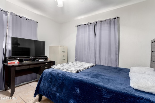 bedroom with ceiling fan and light tile patterned floors