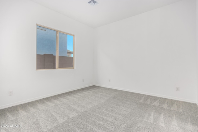 unfurnished room featuring carpet flooring