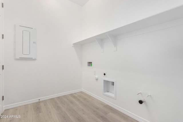 clothes washing area with hookup for a gas dryer, light hardwood / wood-style flooring, washer hookup, and electric dryer hookup