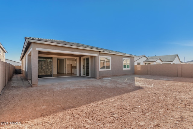 back of house with a patio