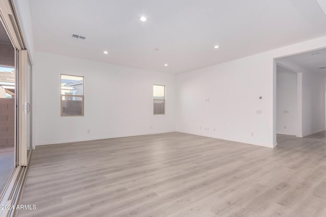 unfurnished room with light hardwood / wood-style floors