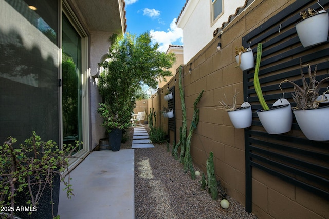 view of property exterior featuring fence