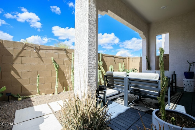 deck with a fenced backyard