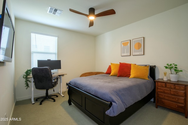 bedroom featuring ceiling fan, light colored carpet, visible vents, and baseboards