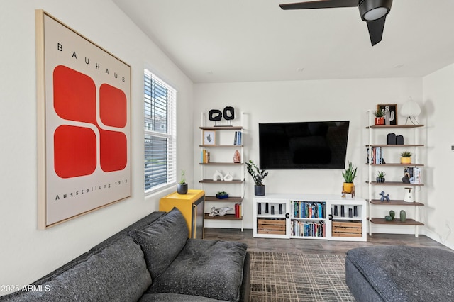 living room featuring wood finished floors and a ceiling fan