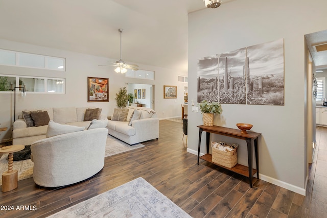 living room featuring dark wood-type flooring and ceiling fan