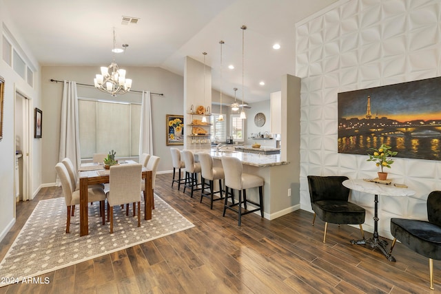 dining area featuring ceiling fan with notable chandelier, lofted ceiling, and dark hardwood / wood-style floors