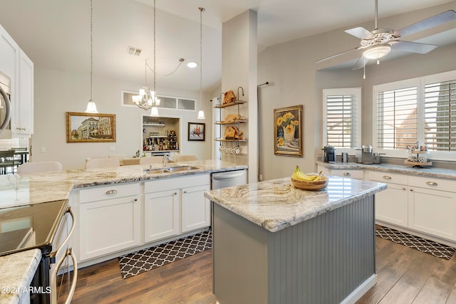 kitchen with sink, ceiling fan with notable chandelier, white cabinetry, hanging light fixtures, and dark hardwood / wood-style flooring