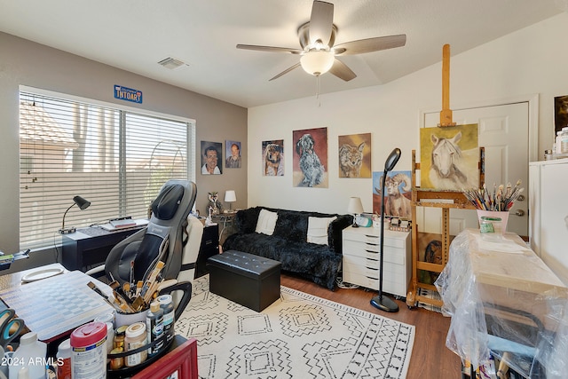 home office featuring wood-type flooring and ceiling fan