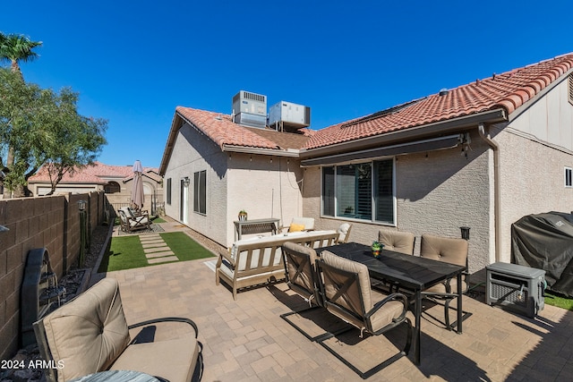 back of property with a patio area