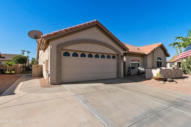 mediterranean / spanish-style house featuring a garage