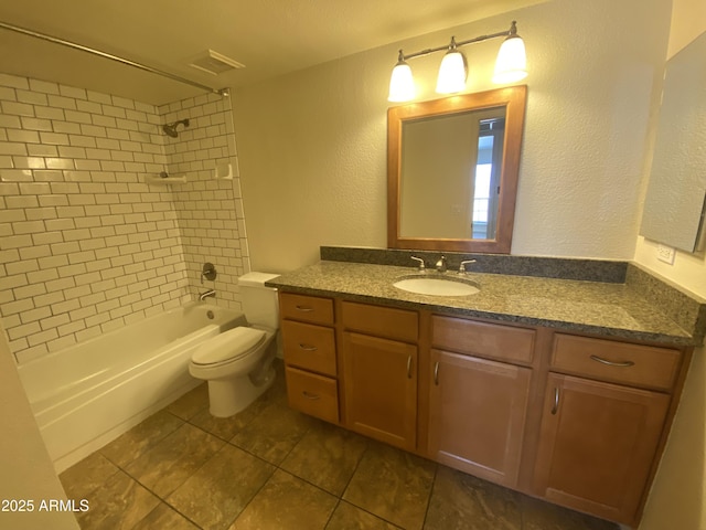 bathroom featuring visible vents, shower / bath combination, a textured wall, toilet, and vanity