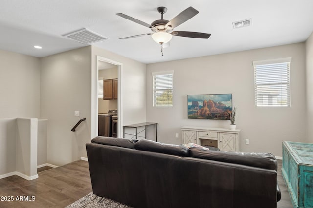 11048 E Quintana Ave, Mesa, AZ 85212 - living room featuring wood finished floors, a ceiling fan, and washer / dryer