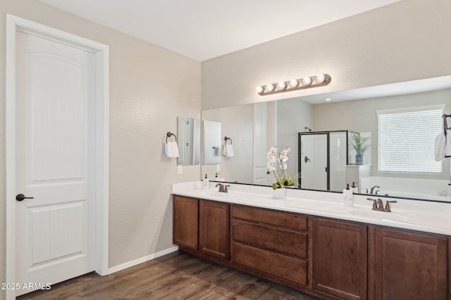 11048 E Quintana Ave, Mesa, AZ 85212 - full bath featuring a shower stall, wood finished floors, double vanity, and a garden tub
