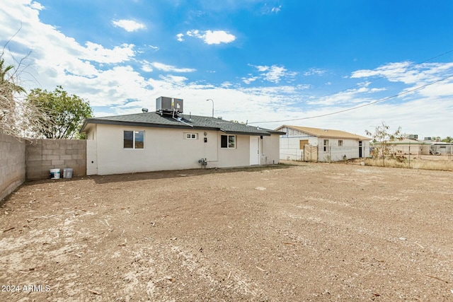 rear view of house with cooling unit